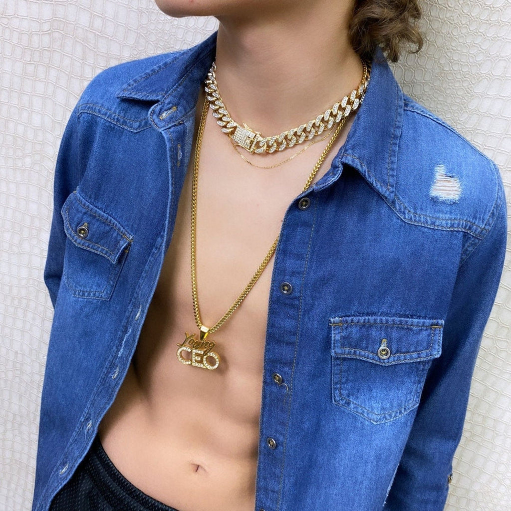Young man wearing ice cuban link with double safety closure and long CEO pendant necklace. Bling bling jewelry gold filled.